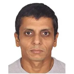 Frontal headshot of man on white background