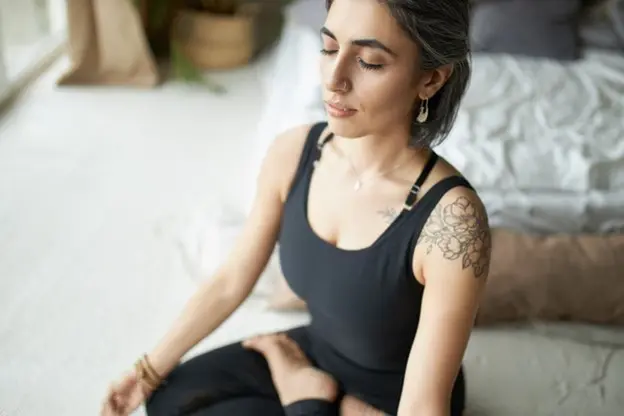 a woman following the Buteyko Breathing Method