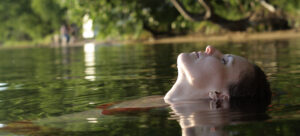 Person floating with head tilted back