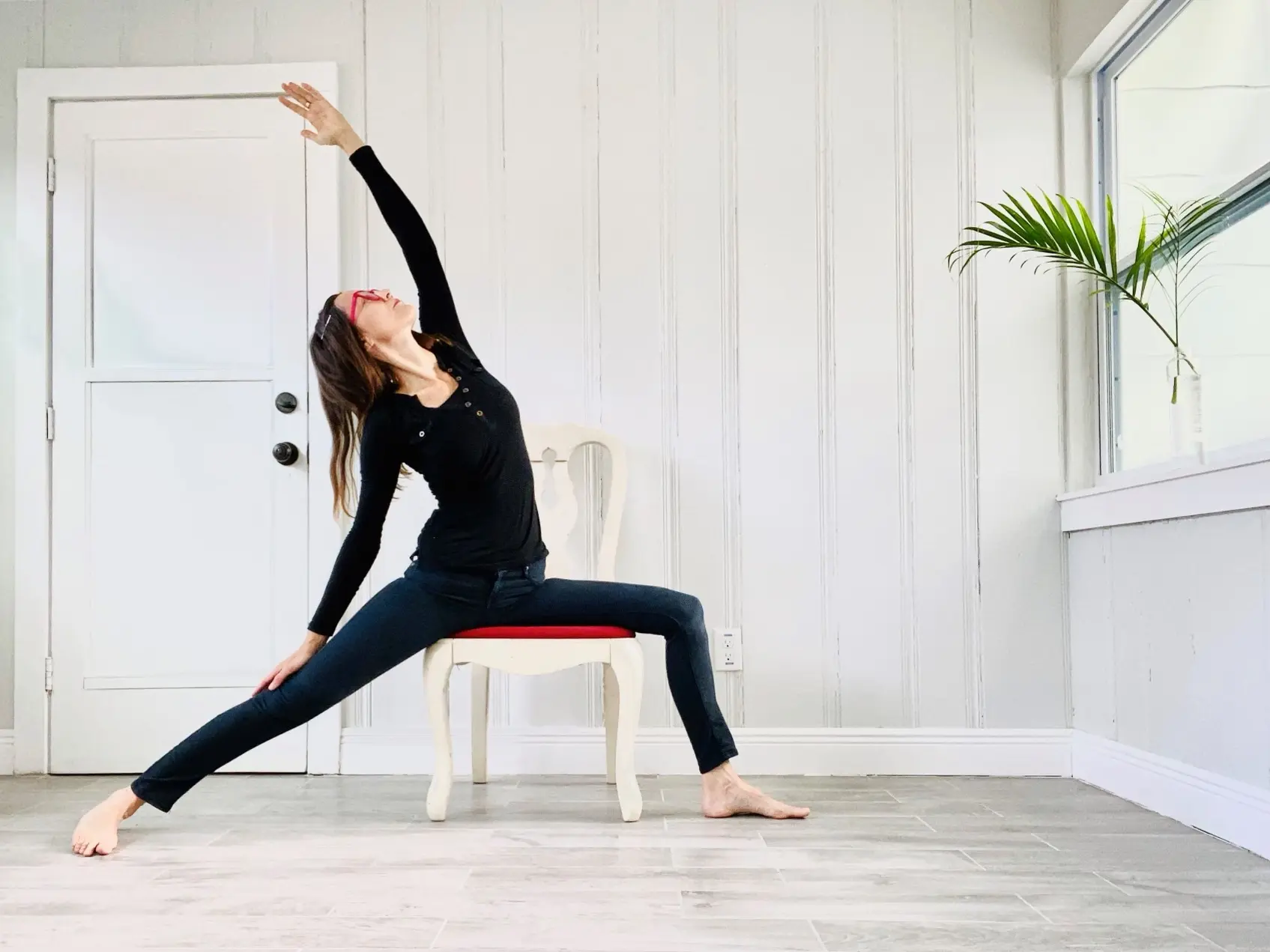 Seated side stretch yoga pose on chair