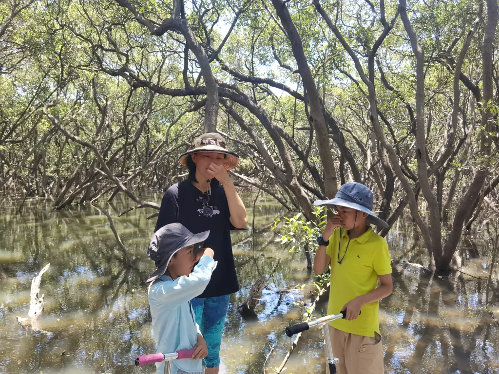 A mother and her sons are practicing Butreyko breath holds.